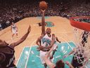 Former Vancouver Grizzlies' star Shareef Abdur-Rahim takes a shot against the Utah Jazz in 1999.