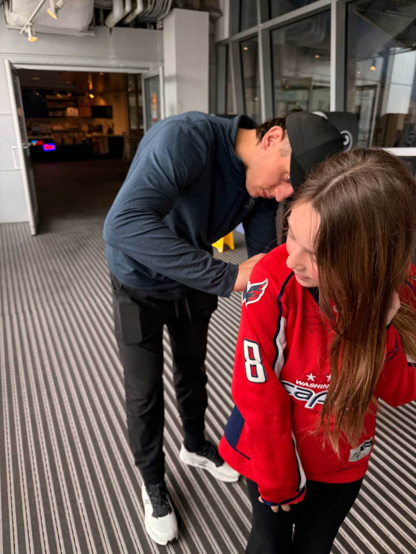 Martin Fehervary signs a jersey for a fan