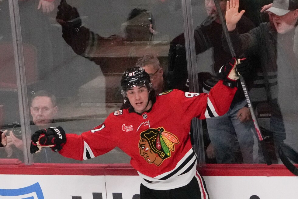Blackhawks forward Frank Nazar departs after getting hit in the face with a puck
