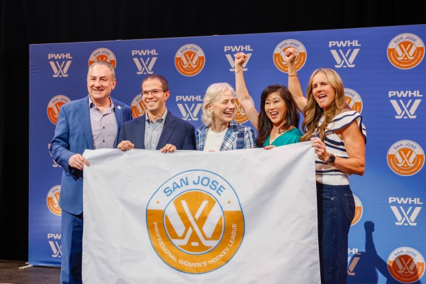 (From left to right) Jonathan Becher, president of Sharks Sports & Entertainment, Royce Cohen, PWHL Advisory Board Member and Senior Vice President, Amy Scheer, Senior Vice President of Business Operations for the Professional Women's Hockey League, Kristi Yamaguchi, Olympic gold medalist, and Brandi Chastain, two-time Olympic gold medalist, celebrate during a press conference announcing a San Jose Professional Women's Hockey League team at SAP Center in San Jose, Calif., on Tuesday, May 19, 2026. (Shae Hammond/Bay Area News Group)