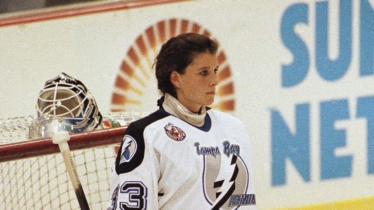 Tampa Bay Lightning goaltender Manon Rheaume listens to the national...