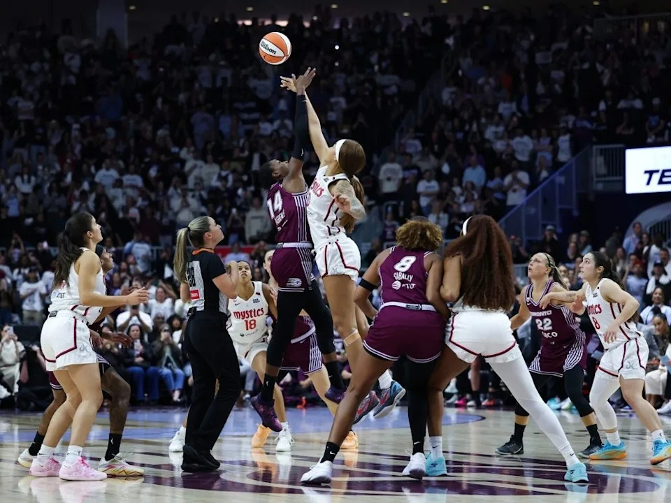 Temi Fagbenle of the Toronto Tempo and Shakira Austin of the Washington Mystics jump for the ball at the start of the game at Coca-Cola Coliseum on May 8, 2026 in Toronto.