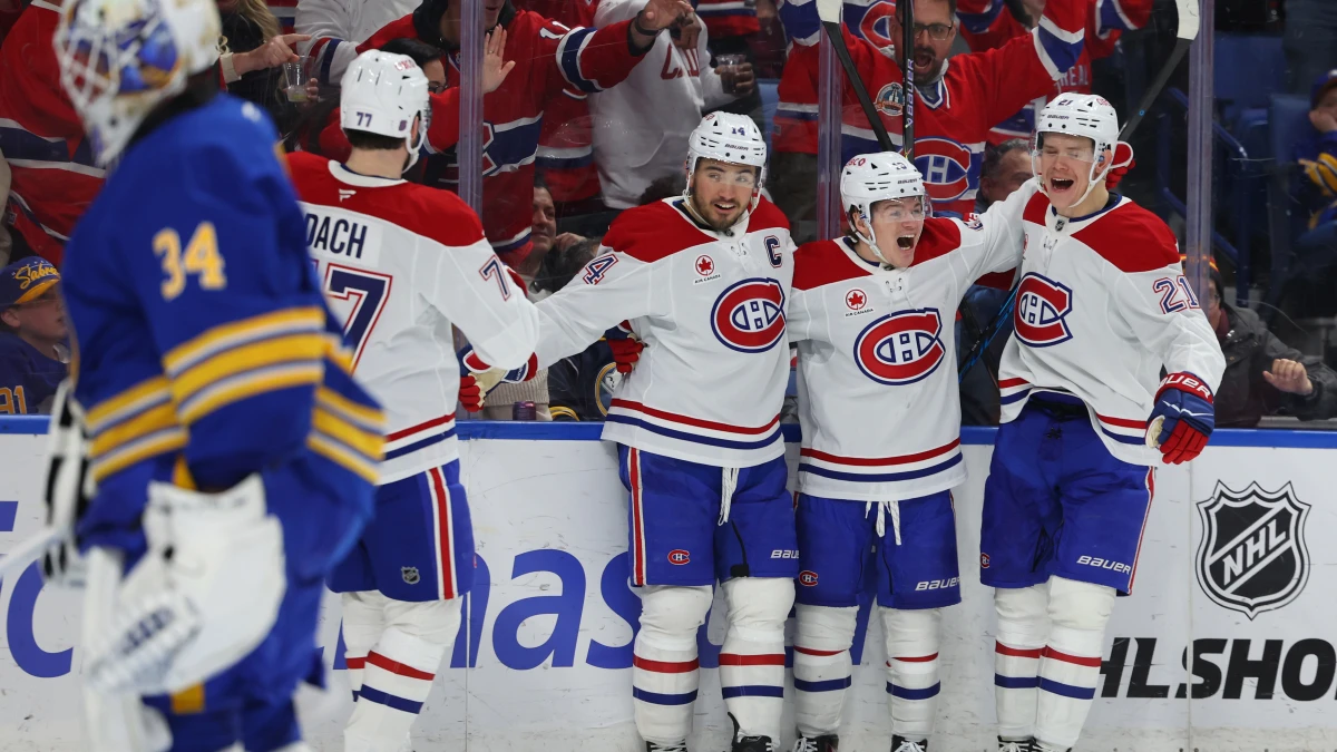 Montr&eacute;al Canadiens right wing Cole Caufield (13) celebrates his second goal of the game with teammates during the third period against the Buffalo Sabres at KeyBank Center.