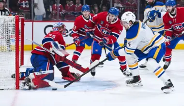 Montreal Canadiens goalie Jakub Dobes (75) makes a save against Buffalo Sabres defenseman Bowen Byram (4) during the second period in game six of the second round of the 2026 Stanley Cup Playoffs at Bell Centre.