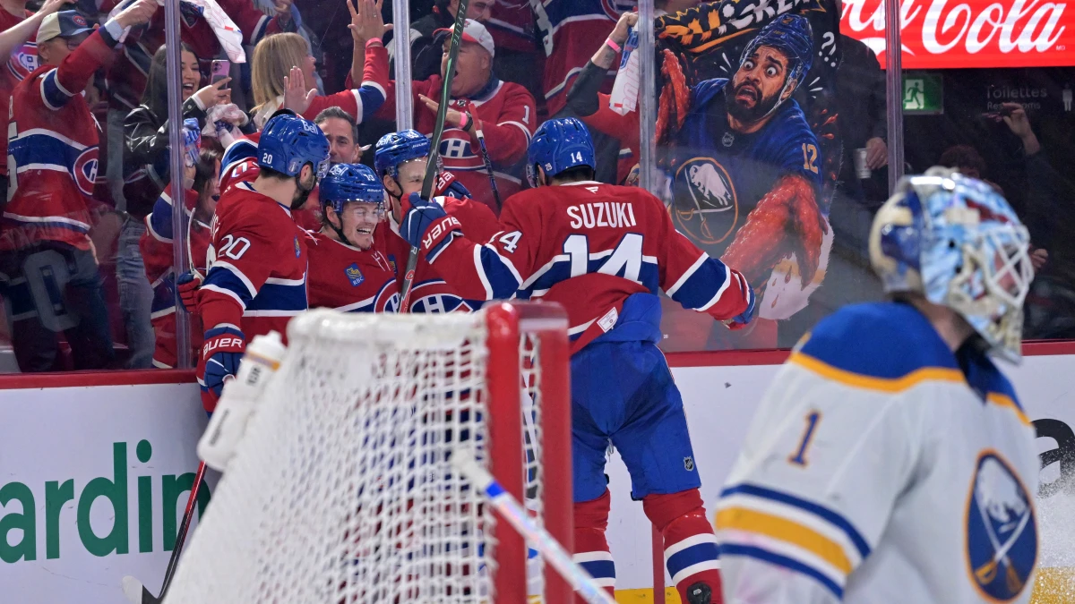 Montreal Canadiens forward Cole Caufield (13) celebrates with teammates forward Juraj Slafkovsky (20) and forward Ivan Demidov (93) and forward Nick Suzuki (14) after scoring a goal against Buffalo Sabres goalie Ukko-Pekka Luukkonen (1) during the first period in game four of the second round of the 2026 Stanley Cup Playoffs at Bell Centre.