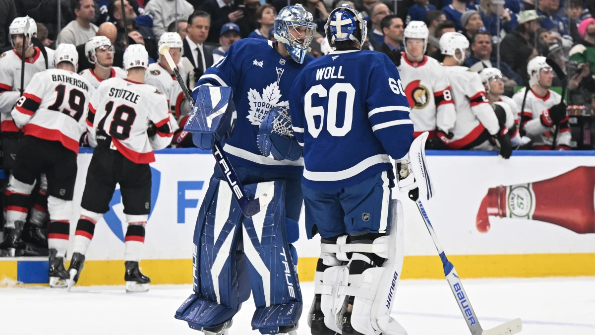 Toronto Maple Leafs substitute goalie Anthony Stolarz (41) speaks to starting goalie Joseph Woll (60) after a change in goalies against the Ottawa Senators in the second period at Scotiabank Arena.