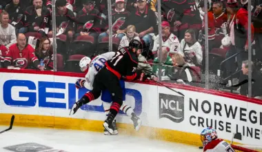 Photo of Dangerous hit by Taylor Hall on Lane Hutson during game between the Montreal Canadiens and Carolina Hurricanes.