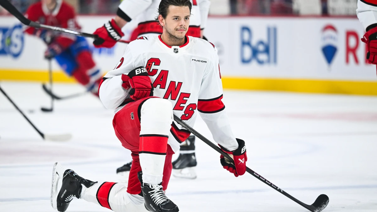 Carolina Hurricanes center Jesperi Kotkaniemi (82) kneels on the ice in warm-up before the game against the Montreal Canadiens at Bell Centre.