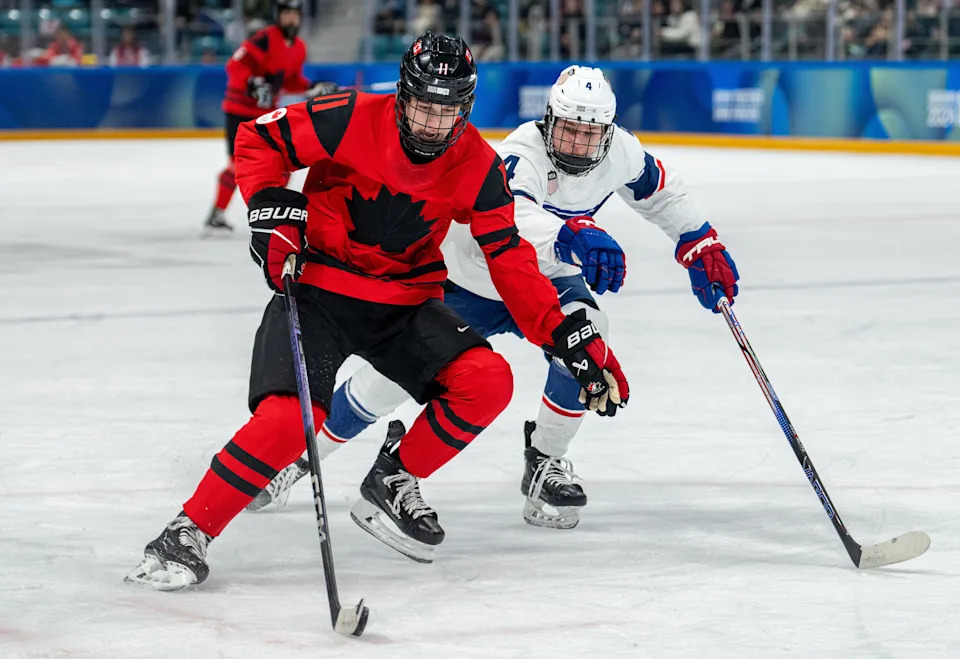 Jan 30, 2024; Gangwon-do, KOR; Tynan Lawrence (CAN) skates with the puck while under pressure from AJ Francisco (USA) in the Ice Hockey Men’s 6-on-6 Tournament Semifinals between Canada and (USA) at the Gangneung Hockey Centre. The Winter Youth Olympic Games, Gangwon, South Korea, Tuesday 30 January 2024. Mandatory Credit: OIS/Thomas Lovelock-USA TODAY Sports