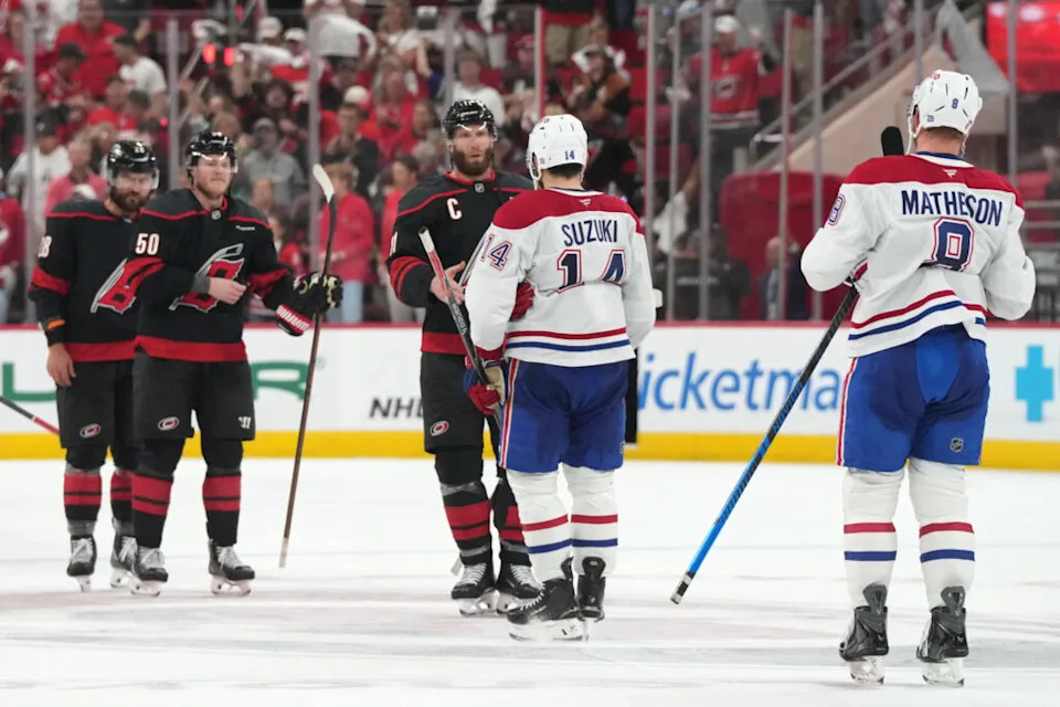 Carolina Hurricanes center Jordan Staal (11) shakes hands with Montreal Canadiens center Nick Suzuki (14) at center ice at Lenovo Center.
