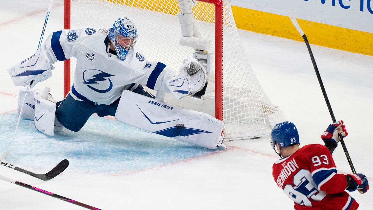 Tampa Bay Lightning goaltender Andrei Vasilevskiy (88) stops a shot by Montreal Canadiens' Ivan Demidov (93) during the second period of Game 6 in the first round of an NHL hockey Stanley Cup playoff series in Montreal, Friday, May 1, 2026. (Christinne Muschi/The Canadian Press via AP)