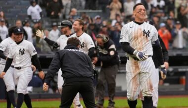 New York Yankees' Aaron Judge, right, reacts after hitting a two-run walk-off home run during the ninth inning of a baseball game against the Tampa Bay Rays, Sunday, May 24, 2026, in New York. (AP Photo/Seth Wenig)