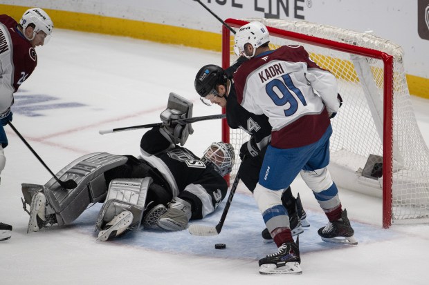 Defenseman Mikey Anderson (44) of the Los Angeles Kings protects the net as center Nazem Kadri (91) of the Colorado Avalanche tries to score on goaltender Anton Forsberg (31) of the Los Angeles Kings during the first period of Game 4 of the first round of the Stanley Cup Playoffs on Sunday, April 26, 2026, at Crypto.com Arena in Los Angeles, Calif. (Photo by Timothy Hurst/The Denver Post)