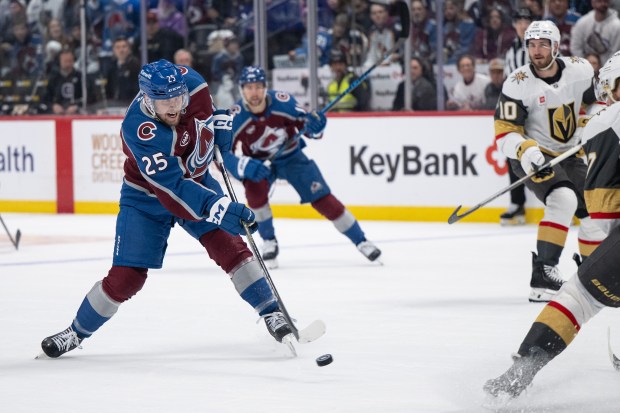 Right wing Logan O'Connor (25) of the Colorado Avalanche shoots while defenseman Ben Hutton (17) of the Vegas Golden Knights defends during the first period of Game 1 of the Western Conference Finals of the Stanley Cup Playoffs on Wednesday, May 20, 2026, at Ball Arena in Denver. (Photo by Timothy Hurst/The Denver Post)