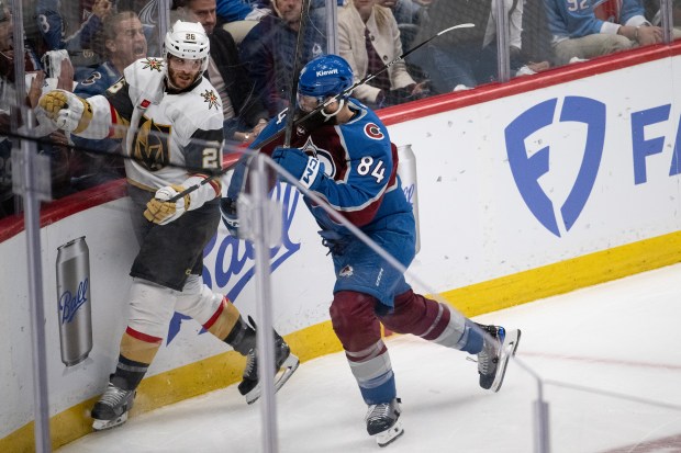 Defenseman Brent Burns (84) of the Colorado Avalanche tees up center Nic Dowd (26) of the Vegas Golden Knights during the second period of Game 2 of the Western Conference Finals of the Stanley Cup Playoffs on Friday, May 22, 2026, at Ball Arena in Denver. (Photo by Timothy Hurst/The Denver Post)