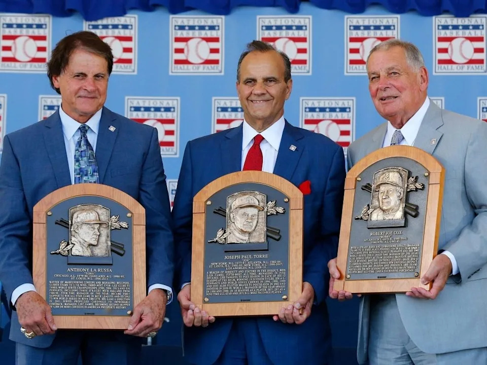 Inductees, from left, Tony La Russa, Joe Torre and Bobby Cox pose with their plaques at Clark Sports Center during the Baseball Hall of Fame induction ceremony on July 27, 2014 in Cooperstown, N.Y. Cox managed for 29 seasons with 2,504 victories and won five National League pennants and the 1995 World Series with the Atlanta Braves.
