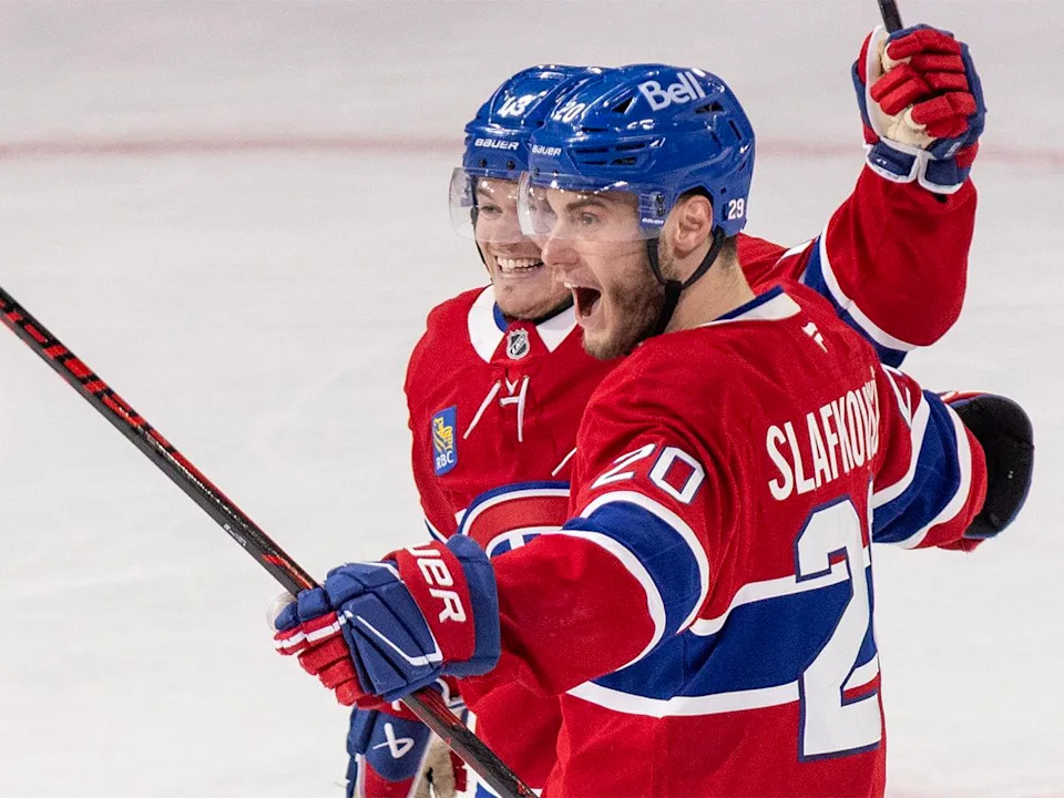 Montreal Canadiens’ Juraj Slafkovsky celebrates with Cole Caufield after scoring against the Buffalo Sabres during the second period of Game 3 of NHL playoff series action in Montreal on Sunday, May 10, 2026.