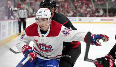 Montreal Canadiens defenseman Lane Hutson (48) vies for the position against Carolina Hurricanes center Seth Jarvis (24) in game five of the Eastern Conference Final of the 2026 Stanley Cup Playoffs during the third period at Lenovo Center