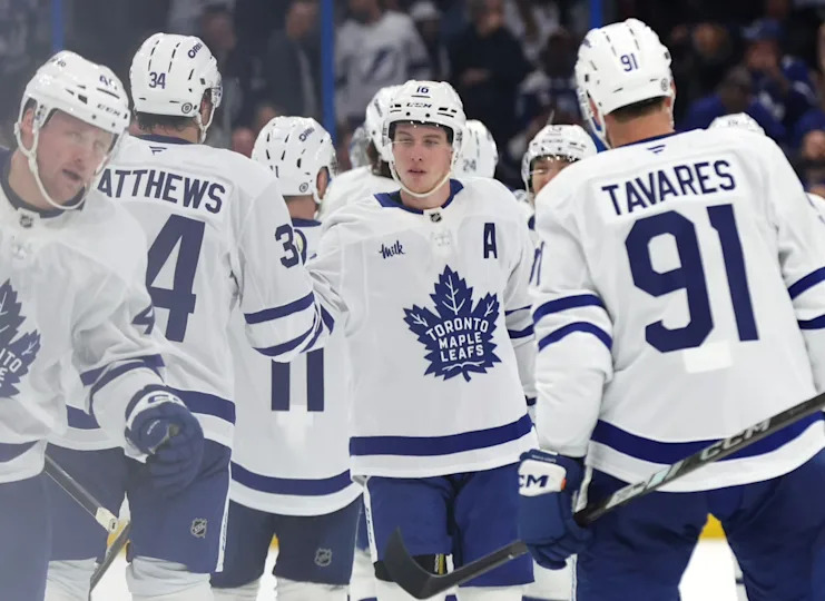 Former Toronto Maple Leafs right wing Mitch Marner (16), center Auston Matthews (34) and teammates celebrate at Amalie Arena