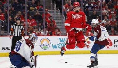 Feb 22, 2024; Detroit, Michigan, USA;  Detroit Red Wings center Dylan Larkin (71) tries to screen Colorado Avalanche goaltender Justus Annunen (60) in overtime at Little Caesars Arena. Mandatory Credit: Rick Osentoski-Imagn Images