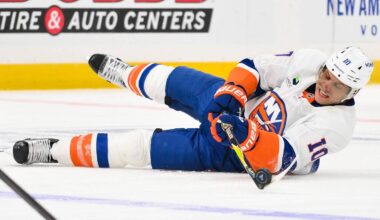 Mar 10, 2026; St. Louis, Missouri, USA; New York Islanders center Brayden Schenn (10) passes the puck as he falls to the ice during the third period against the St. Louis Blues at Enterprise Center. Mandatory Credit: Jeff Curry-Imagn Images