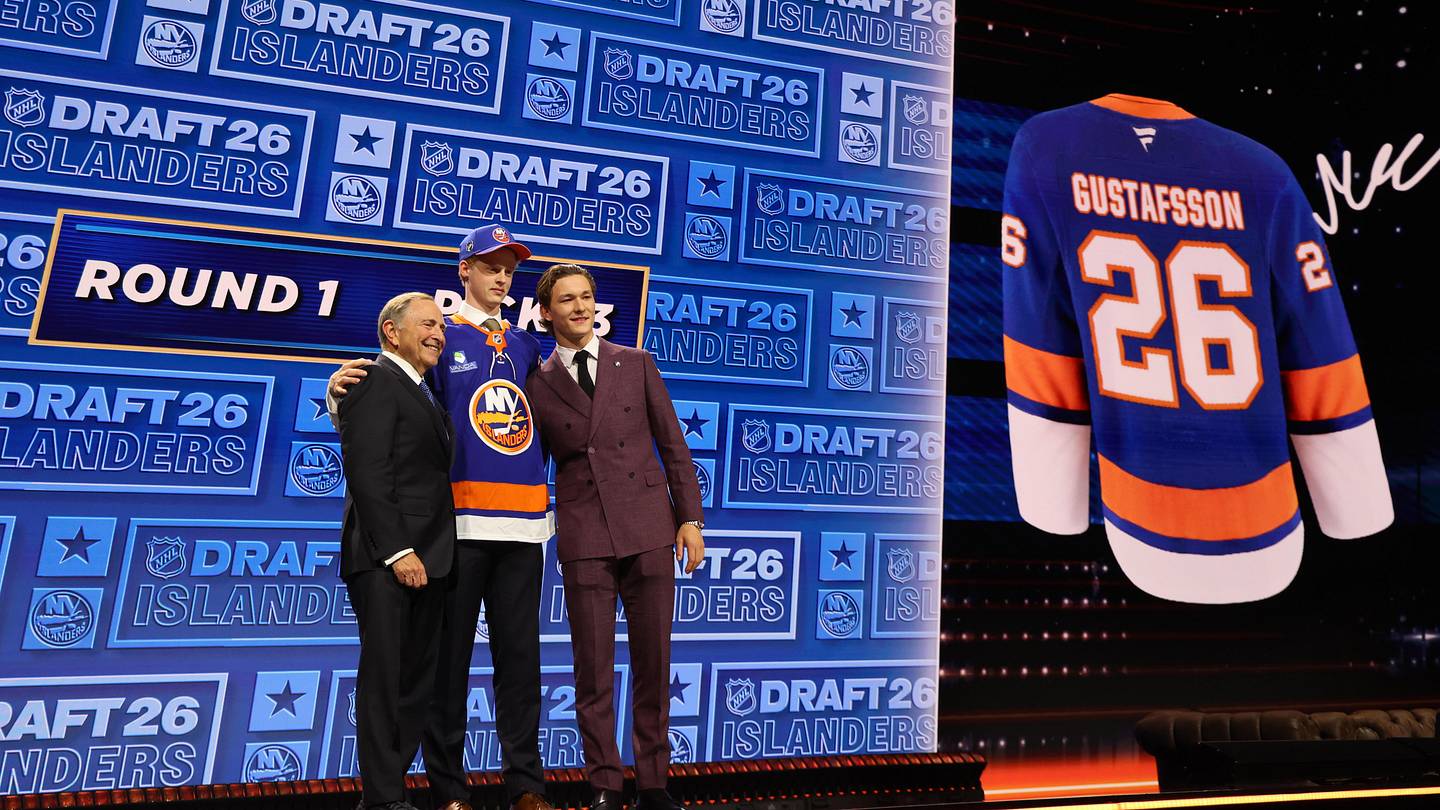 Jun 26, 2026; Buffalo, New York, USA; Malte Gustafsson reacts beside NHL commissioner Gary Bettman and New York Islanders player Matthew Schaefer after being selected with the thirteenth pick in the first round of the 2026 NHL Draft by the Islanders at KeyBank Center. Mandatory Credit: Timothy T. Ludwig-Imagn Images