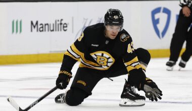 Oct 11, 2025; Boston, Massachusetts, USA; Boston Bruins defenseman Jordan Harris (43) reaches for a puck to keep it in the zone during the third period against the Buffalo Sabres at TD Garden. Mandatory Credit: Winslow Townson-Imagn Images