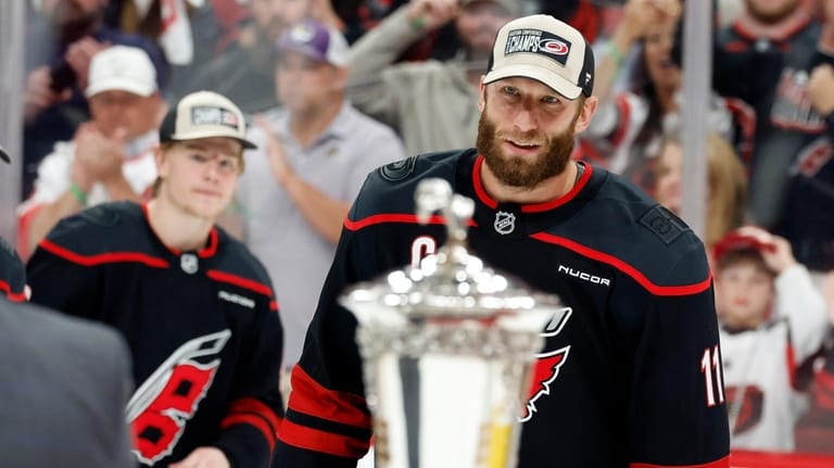 Carolina Hurricanes' Jordan Staal (11) skates to accept the Prince...