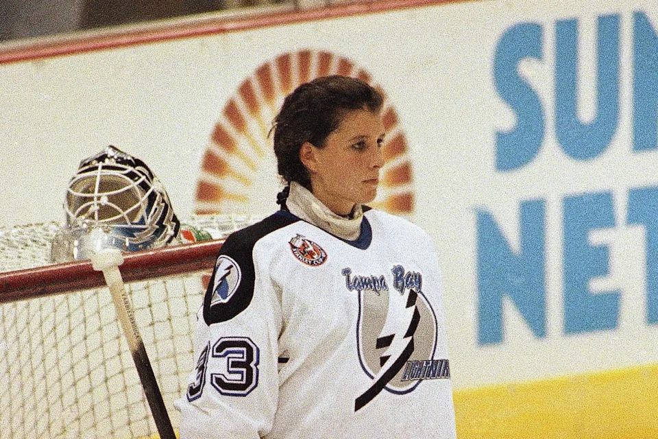 FILE — Tampa Bay Lightning goaltender Manon Rhéaume listens to the national anthem prior to her professional debut against the St. Louis Blues on Sept. 23, 1992 at the Tampa Fairgrounds in Tampa, Fla. (AP Photo/Chris O’Meara, File)