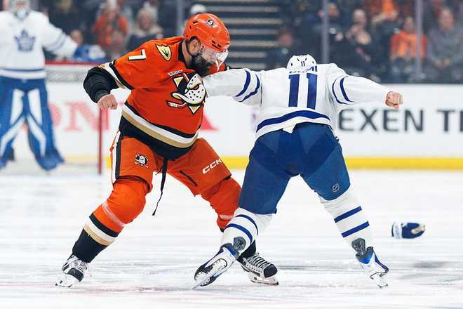 Toronto Maple Leafs v Anaheim Ducks ANAHEIM, CALIFORNIA - MARCH 30: Radko Gudas #7 of the Anaheim Ducks and Max Domi #11 of the Toronto Maple Leafs fight during the first period at Honda Center on March 30, 2026 in Anaheim, California. (Photo by Ric Tapia/Getty Images)