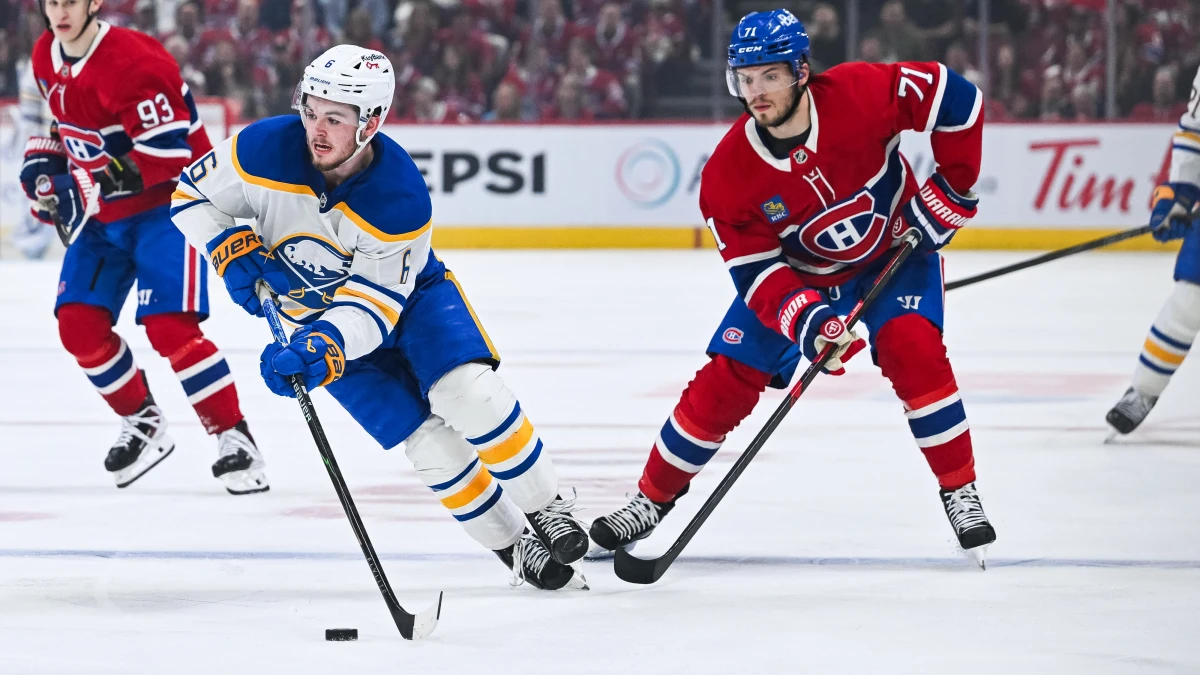 Buffalo Sabres left wing Zach Benson (6) plays the puck against Montreal Canadiens center Jake Evans (71) during the second period in game six of the second round of the 2026 Stanley Cup Playoffs at Bell Centre.
