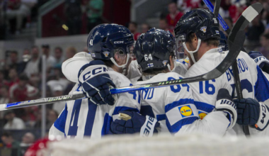 Barkov celebrates with his teammates during the semi-finals match against Canada.