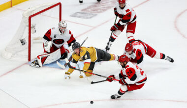 Brandon Bussi #32, K'andre Miller #19, Sean Walker #26 and Seth Jarvis #24 of the Carolina Hurricanes defend the net against Jack Eichel #9 of the Vegas Golden Knights in the third period of Game Six of the 2026 NHL Stanley Cup Final at T-Mobile Arena on June 14, 2026 in Las Vegas, Nevada. The Hurricanes defeated the Golden Knights 3-0 to win the series four games to two.