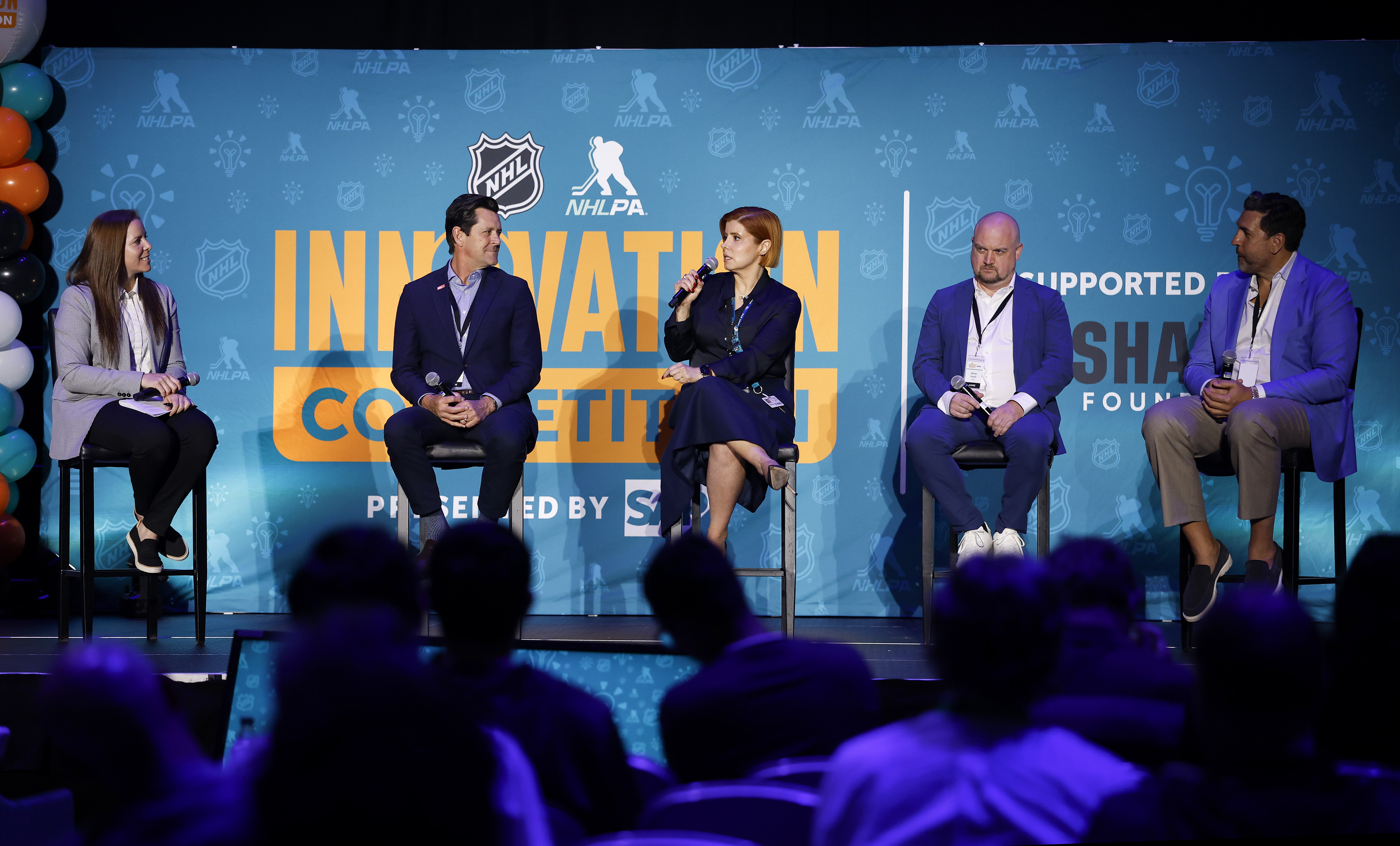 Neda Tabatabaie, center, Senior Vice President of Business Analytics and...