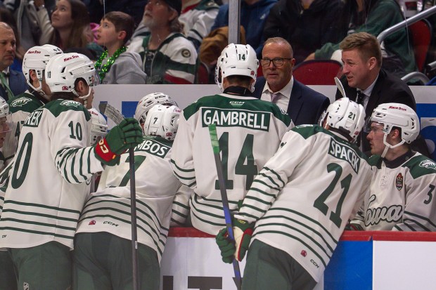 During the 2025-26 AHL season, Greg Cronin (back row, in glasses) coached the Iowa Wild to a 27-36-6-3 record. (Courtesy Iowa Wild)