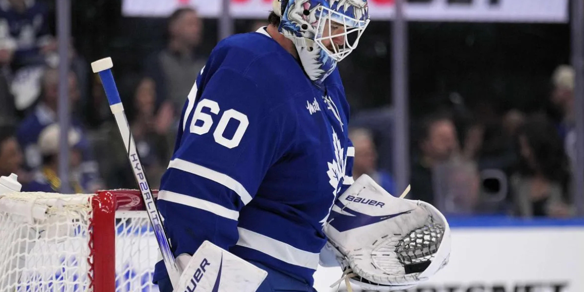 Joseph Woll holding puck after a save for the Toronto Maple Leafs