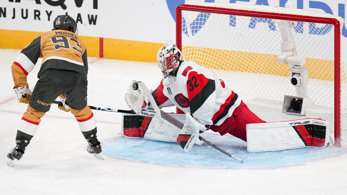 Brandon Bussi makes a save on Mitch Marner