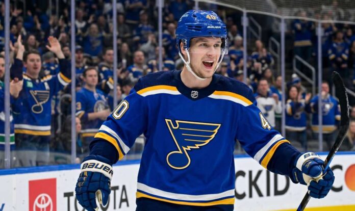 Smiling Elias Pettersson wearing a St. Louis Blues home jersey with Blue Note logo and #40 helmet, celebrating on ice with cheering crowd; speculative trade visualization.
