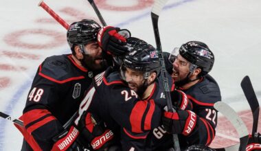 Carolina Hurricanes' Jordan Martinook (48), Seth Jarvis (24), Shayne Gostisbehere (4) and Logan Stankoven (22) celebrate after Jarvis scored the game-winning goal against the Vegas Golden Knights in overtime of Game 2 of the Stanley Cup Final series in Raleigh, N.C., on Thursday, June 4, 2026. (AP File Photo/Ben McKeown)