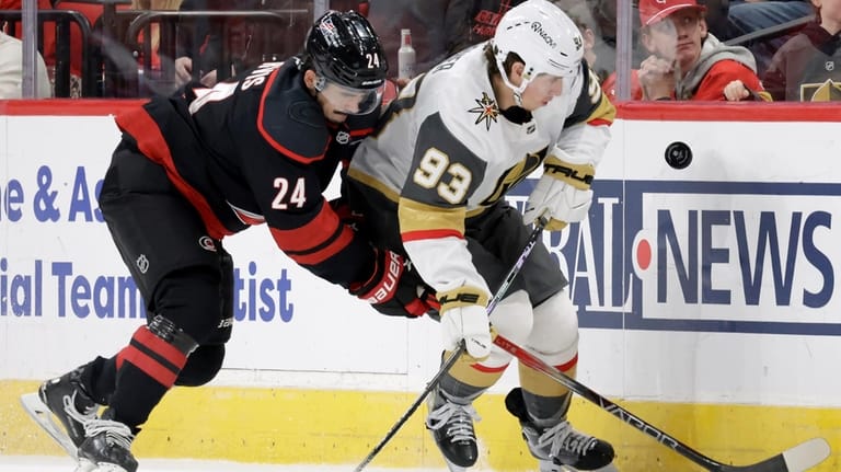 Carolina Hurricanes center Seth Jarvis (24) and Vegas Golden Knights...