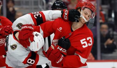 Jan 7, 2025; Detroit, Michigan, USA; Ottawa Senators center Zack Ostapchuk (38) shoves Detroit Red Wings defenseman Moritz Seider (53) in the first period at Little Caesars Arena. Mandatory Credit: Rick Osentoski-Imagn Images