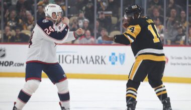 Mar 21, 2025; Pittsburgh, Pennsylvania, USA;  Pittsburgh Penguins left wing Bokondji Imama (14) and Columbus Blue Jackets right wing Mathieu Olivier (24) fight during the first period at PPG Paints Arena. Mandatory Credit: Charles LeClaire-Imagn Images