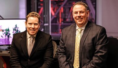 RALEIGH, NC - MARCH 12: TV personalities Tripp Tracy and Mike Maniscalco of the Carolina Hurricanes prepare for a broadcast prior to an NHL game against the Philadelphia Flyers on March 12, 2022 at PNC Arena in Raleigh, North Carolina. (Photo by Gregg Forwerck/NHLI via Getty Images)