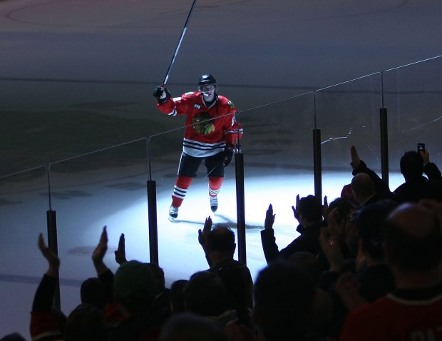 The Blackhawks' Patrick Kane waves his stick to the fans after being named the No. 1 star of the game in a 6-2 win over the Red Wings on April 2, 2008, at the United Center. (Charles Cherney/Chicago Tribune)