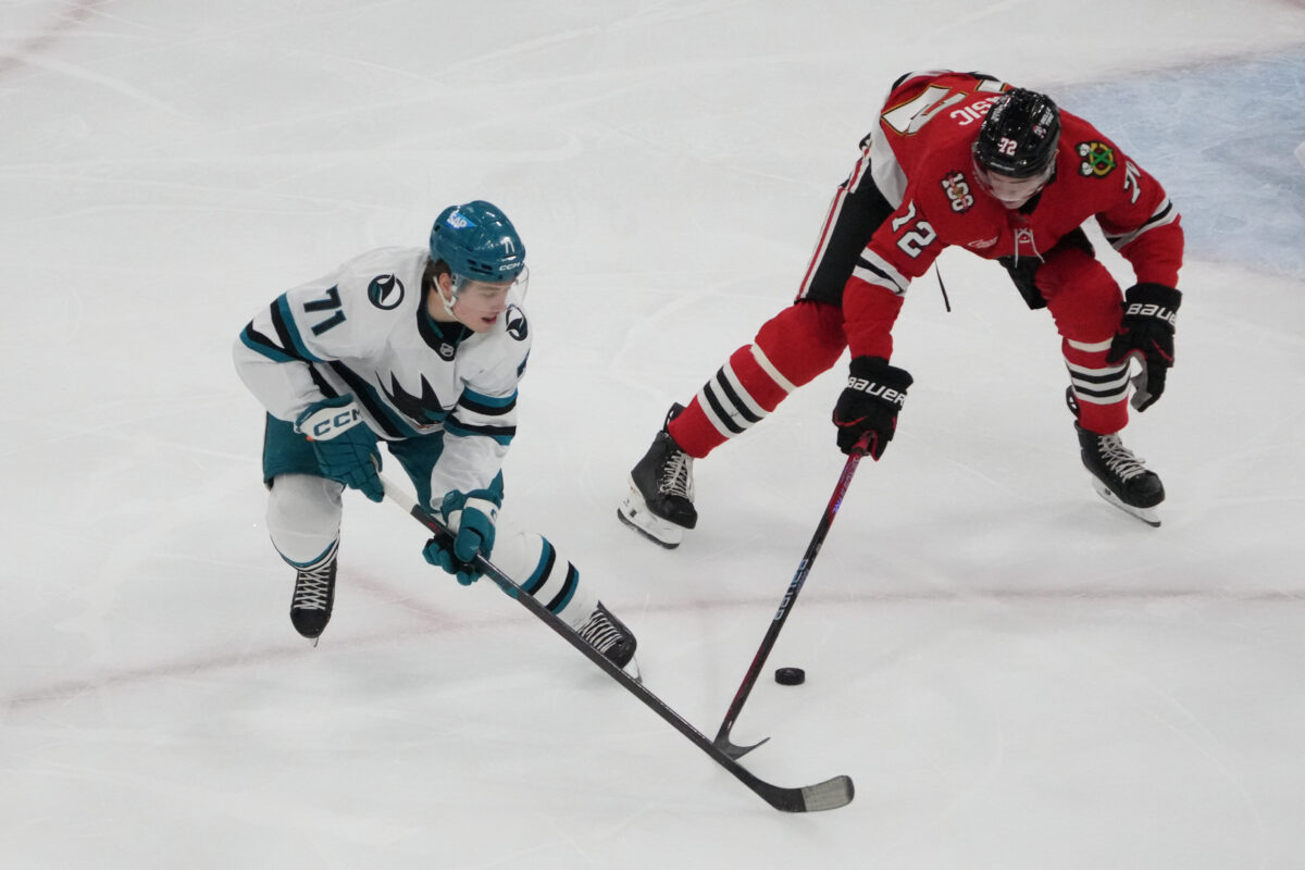 Apr 15, 2026; Chicago, Illinois, USA; Chicago Blackhawks defenseman Alex Vlasic (72) defends San Jose Sharks center Macklin Celebrini (71) during the first period at United Center. Mandatory Credit: David Banks-Imagn Images