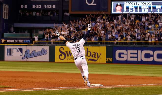 ST. PETERSBURG, FL - SEPTEMBER 28:  Evan Longoria #3 of the Tampa Bay Rays rounds the bases after his game-winning walk off home run in the twelfth inning against the New York Yankees during the game at Tropicana Field on September 28, 2011 in St. Petersburg, Florida.  (Photo by J. Meric/Getty Images)