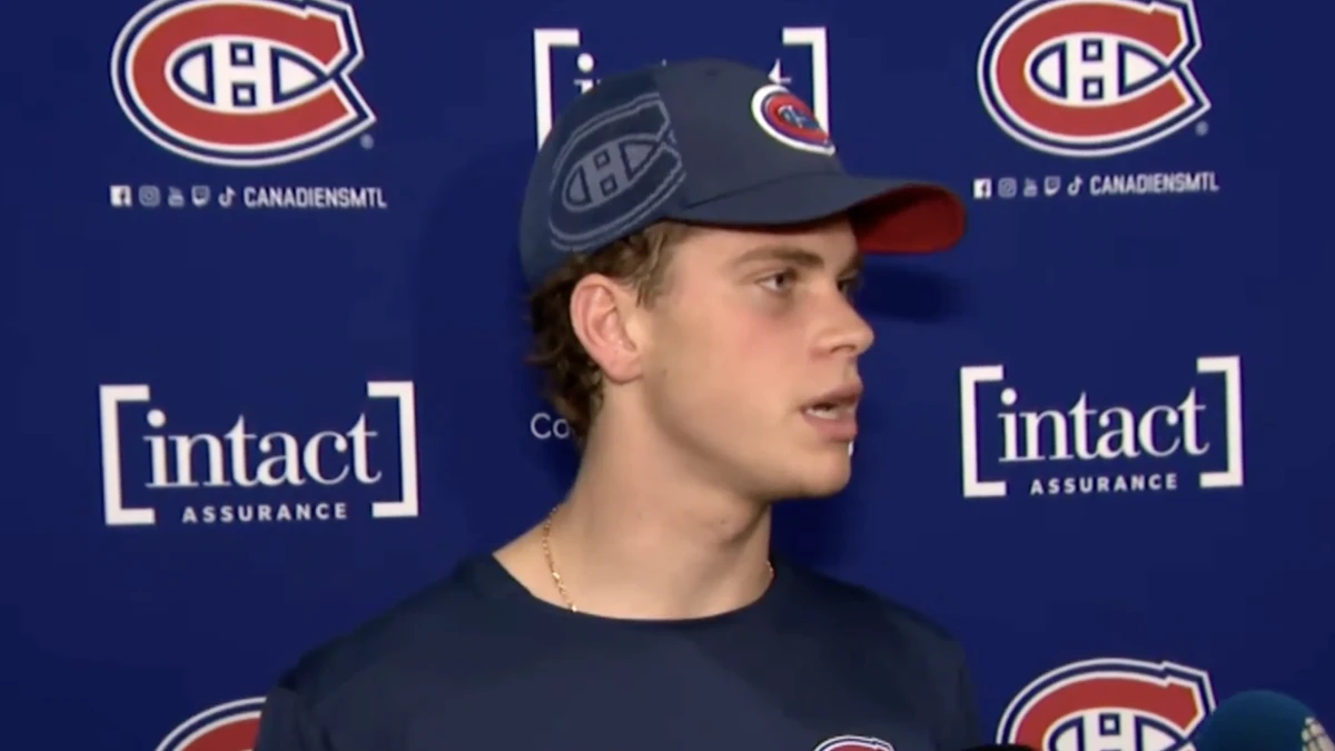 Timofei Runtso of the Montreal Canadiens speaks to the media during a press conference.