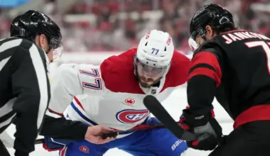 Montreal Canadiens center Kirby Dach (77) prepares for a faceoff against Carolina Hurricanes left wing Mark Jankowski (77) in game five of the Eastern Conference Final of the 2026 Stanley Cup Playoffs during the second period at Lenovo Center.
