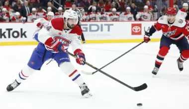 Montreal Canadiens center Phillip Danault (24) passes the puck as Washington Capitals center Hendrix Lapierre (29) chases during the first period at Capital One Arena.