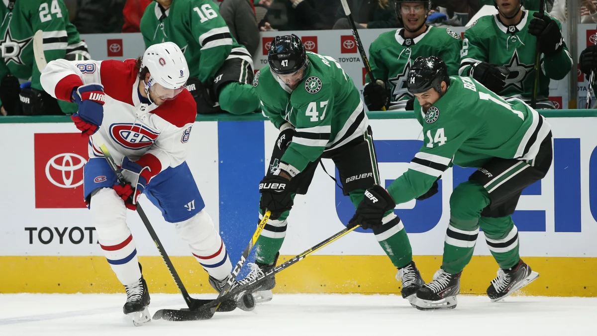 Dallas, Texas, USA: Montreal Canadiens defenseman Ben Chiarot (8) battles for the puck against Dallas Stars right winger Alexander Radulov (47) and left winger Jamie Benn (14) during the first period at American Airlines Center.